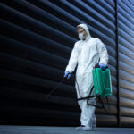 person white chemical protection suit doing disinfection public areas stop spreading highly contagious corona virus