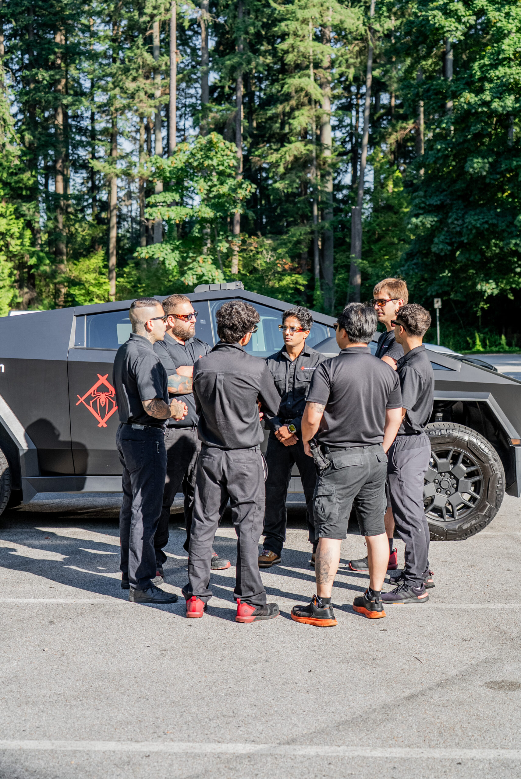 Phantom Pest Control technicians gathered beside the company's branded truck